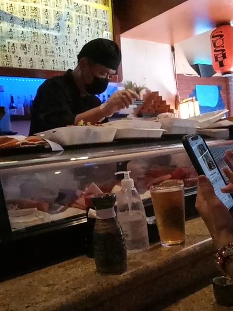 Sushi rolls on a small restaurant table.