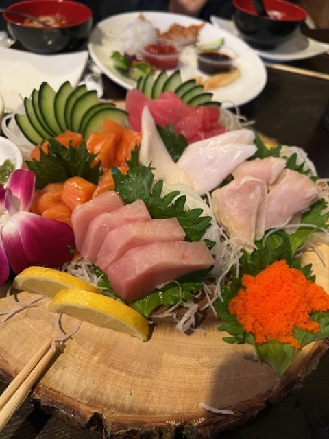 Counter seating inside a casual sushi spot.